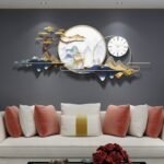 ⁦ساعة حائط مع ديكور جداري⁩ - الصورة ⁦2⁩